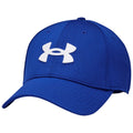 A blue baseball cap features a prominent white Under Armour logo on the front and is designed for casual or sporty wear in outdoor environments.