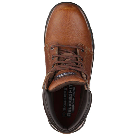 A brown leather shoe sits on a flat surface featuring laces and a relaxed fit associated with comfort indicating it's designed for casual or work settings.