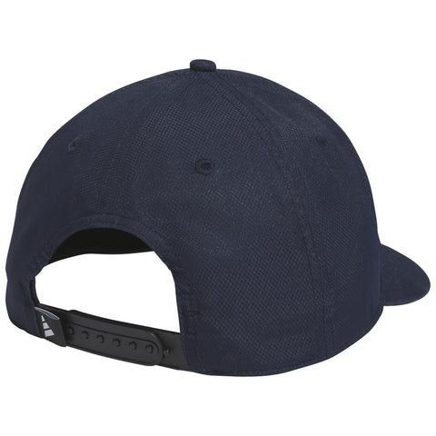 A dark navy baseball cap with a flat brim is positioned to show the back view featuring an adjustable strap and ventilation eyelets in a simple setting.