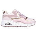 A pink and gold sneaker features a smooth design with a thick white sole and a visible air cushioning unit in the heel area placed on a plain white background.