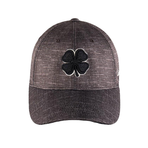 A cap features a textured gray fabric with a black four-leaf clover emblem on the front. It is designed for casual wear and typically worn outdoors.