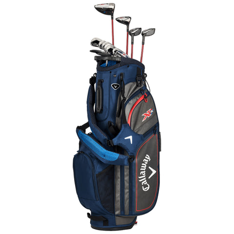 A navy golf bag stands upright with clubs inserted at the top featuring a shoulder strap and various pockets for accessories set against a neutral background.