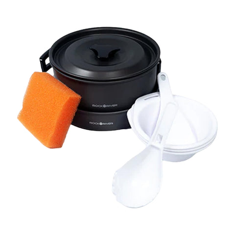 A black container with a lid is surrounded by an orange sponge a white scoop and two white bowls indicating a cleaning or serving set for outdoor activities.