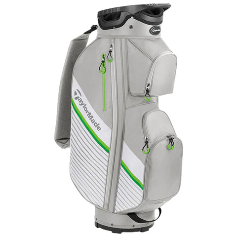 A golf bag stands upright featuring multiple zippered compartments for equipment storage the bag is primarily gray with white and green accents designed for organization and easy access during play