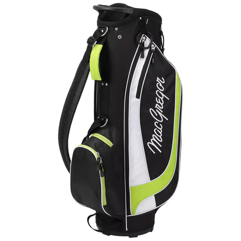 A black and white golf bag with green accents stands upright showcasing its compartments and shoulder strap in a simple indoor environment likely for storing and transporting golf clubs.