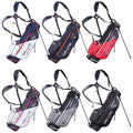 Six golf bags are displayed in a grid with various colors and designs. Each bag features a shoulder strap and two supporting legs for standing.