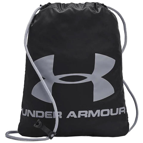 A black drawstring backpack features a large silver Under Armour logo. The bag is designed to hold items while being carried easily on the back or shoulder.