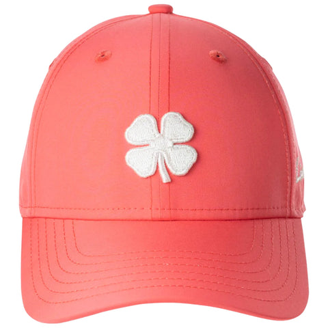 A coral baseball cap features a white embroidered four-leaf clover logo on the front designed for casual outdoor wear in sunny environments.