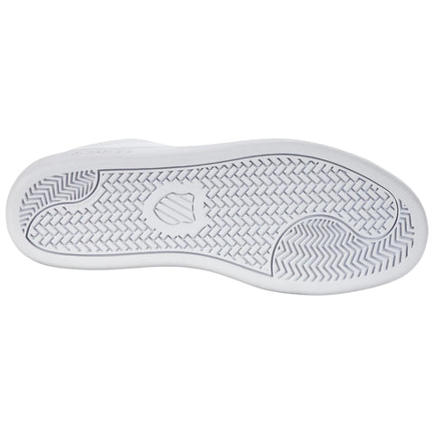 A white shoe sole features a textured rubber design for grip the shoe is positioned horizontally against a plain background showing no additional context or surrounding elements