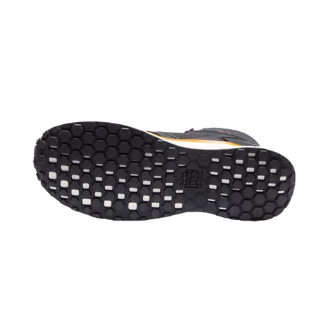 A shoe sole features a textured pattern with hexagonal segments and circular grips designed for traction and stability while in motion on various surfaces.