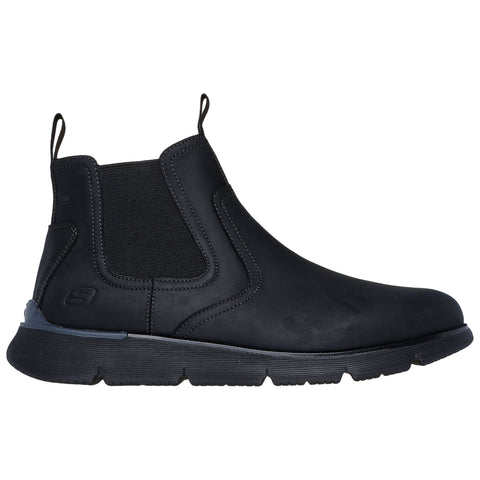 A black ankle boot features a sleek design with elastic side panels and pull tabs for easy wear located on a textured rubber sole suitable for casual or semi-formal settings.