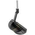 A golf putter is positioned upright showcasing its sleek design and black finish with a gold accent line on the head and a silver shaft ready for use on the green.