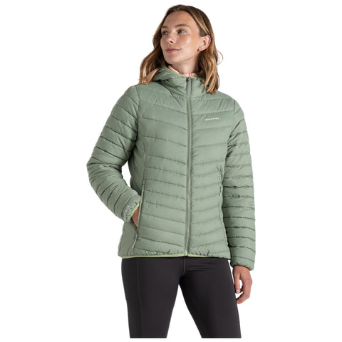 A person is wearing a light green, puffy jacket with a hood and chevron stitching shown from the back in a neutral setting suggesting a casual outdoor context.