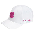 A white baseball cap features a pink four-leaf clover design on the front and the phrase Live Lucky embroidered in pink on the side, suitable for casual outdoor wear.