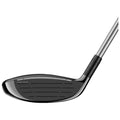 A golf club head with a sleek black face is positioned facing left showcasing grooves for optimal ball contact in a minimalistic presentation setting