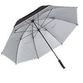 A large umbrella with a black upper canopy and a lighter gray underside is opened wide displaying its radial structure and a textured grip handle suitable for providing shade or shelter outdoors.