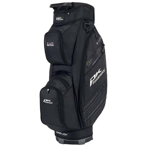 A black golf bag stands upright featuring multiple zippered pockets for storage and a sturdy base for stability in outdoor settings such as a golf course or practice area.