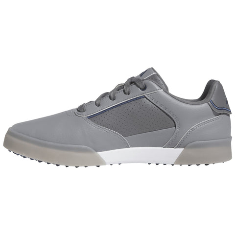 Gray athletic shoe with a sleek design features lace-up closure and perforated detailing on the side standing alone against a white background highlighting its modern style and functionality.