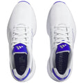 White athletic shoes with purple accents are positioned side by side laced tightly showcasing their design The shoes are set against a neutral background emphasizing their features and colors