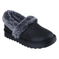 A black slipper with a soft gray fur lining rests on a flat surface showcasing its rounded toe and textured sole designed for comfort and warmth in indoor settings.