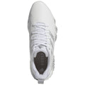 A white athletic shoe features a textured upper with laces and a prominent "BOOST" logo on the insole highlighting its cushioning technology in a neutral background.