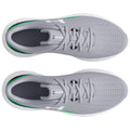 Gray athletic shoes are displayed from a top view showcasing a mesh upper and an accent of green along the sole designed for comfort and performance in a sporty context.