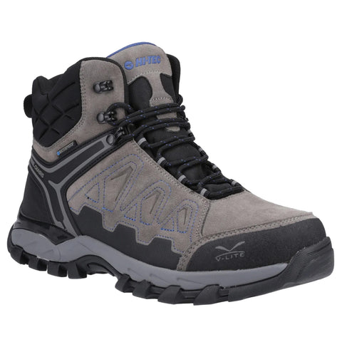 A hiking boot designed for outdoor activities features a gray and black upper with synthetic materials a textured sole for traction and laces for secure fitting in a neutral background.