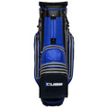 A blue and black golf bag stands upright featuring multiple zipped compartments and a large pocket at the bottom with the word CUBE prominently displayed on it.