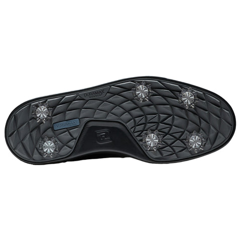 A black shoe sole features diamond-shaped tread patterns with six clear spikes for traction. It is designed for enhanced grip on various surfaces, suitable for sports or outdoor activities.