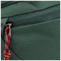 A green fabric bag features a zipper closure with a silver pull tab and a red braided strap attached suggesting a portable use in a casual or outdoor setting.