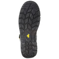 A black rubber shoe sole with a deep tread pattern is positioned upright on a surface showcasing its rugged design and a small yellow logo featuring the number four.