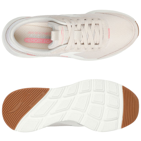 A light beige athletic shoe sits flat showcasing its lightweight mesh upper and a textured rubber sole. The design highlights the brand name and features a pink memory foam label inside.