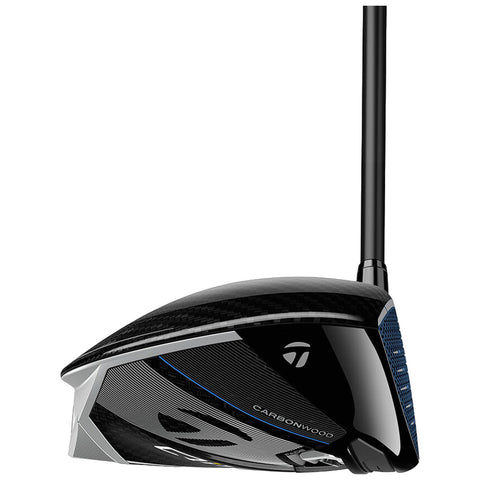 A golf driver is displayed from a low angle highlighting its sleek carbon fiber design and a dark reflective surface with branding visible emphasizing its advanced technology for achieving long-distance shots.