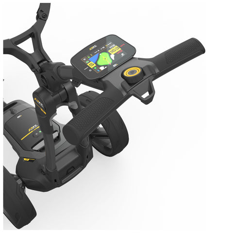 A black and yellow golf trolley features a digital display showing various metrics and controls located on the handle while being designed for use on a golf course.