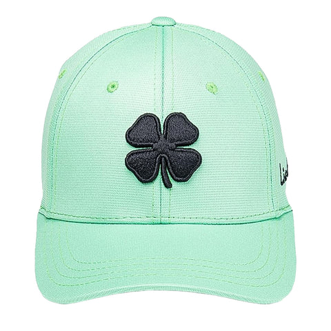 A mint green baseball cap features a black four-leaf clover emblem prominently stitched on the front showcasing a sporty design suitable for casual outdoor wear.