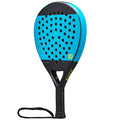 A blue and black paddle is positioned upright showcasing its perforated striking surface and textured grip handle while a wrist strap extends from the bottom.