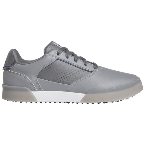 A grey athletic shoe features smooth leather and mesh panels with perforations and laces. The sole is designed for traction, suitable for outdoor activities or casual wear.