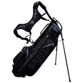 A black golf bag stands upright with a strap attached for carrying. It features multiple zippered pockets and has "ORBITE" and "RAIN DRY" printed on the side.