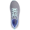 A gray athletic shoe with mesh fabric and light blue laces is positioned facing upward against a white background. It features a cushioned interior and a sleek design for comfort.