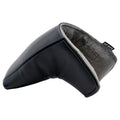 A black leather golf headcover is positioned at an angle showcasing its smooth exterior and plush interior lining indicating protection for a golf club within an appropriate context for golf accessories.