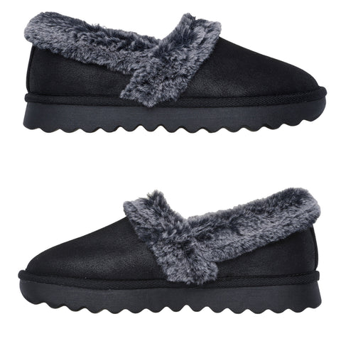 Black slippers with a plush gray furry trim are displayed side by side. They feature a rounded toe and a textured sole for comfort and warmth in a home setting.