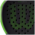 A black padel racket with a distinct green design features numerous perforations across its surface The brand name Wilson and the model Blade Elite are marked at the top