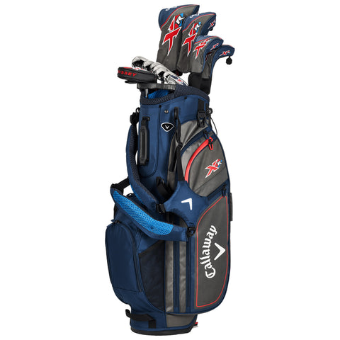 A dark blue golf bag stands upright holding several golf clubs emerging from its top compartment while featuring padded straps and external pockets for accessories on a neutral background