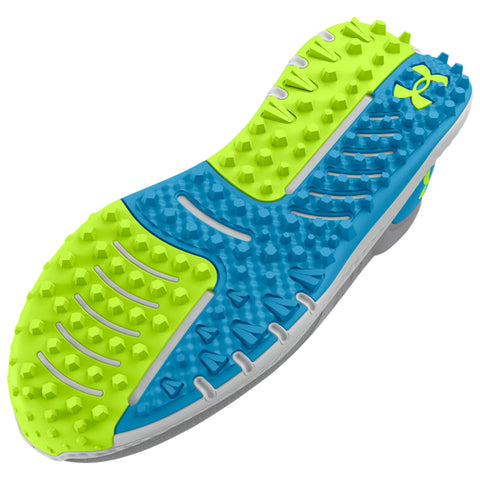 A shoe sole features a multi-colored design with bright green and blue sections equipped with textured grips for traction designed for athletic performance on various surfaces.