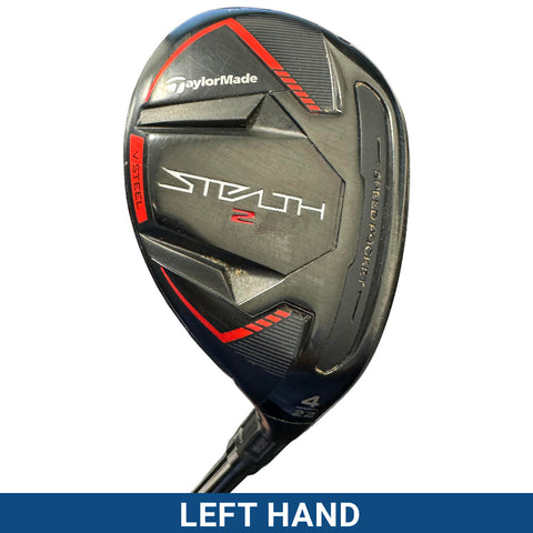 A golf club with a sleek head marked "Stealth 2" is positioned at an angle. It features a black and red design, emphasizing performance and modernity, likely found in a sporting context.