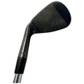 A golf club head is shown angled upward with a textured face for striking the ball held by a metallic shaft, highlighting its polished appearance against a white background.