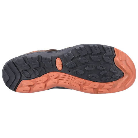 A shoe sole designed for traction and stability featuring a pattern of grooves and ridges the context highlights the functional and rugged nature of the object