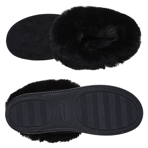 Black fuzzy slipper showing the top and bottom view with a soft plush upper and a textured rubber sole designed for indoor comfort and warmth labeled with the brand name Skechers