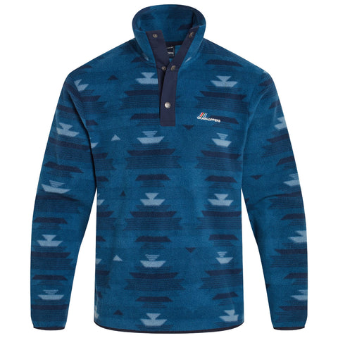 A blue patterned fleece pullover features a high collar and buttoned neck. The design includes geometric shapes in varying shades of blue, set against a soft fabric texture.