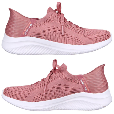 A pair of pink athletic shoes is showcased with a sleek design featuring a breathable mesh upper and a white, textured sole highlighting the laces and branding on the heel.